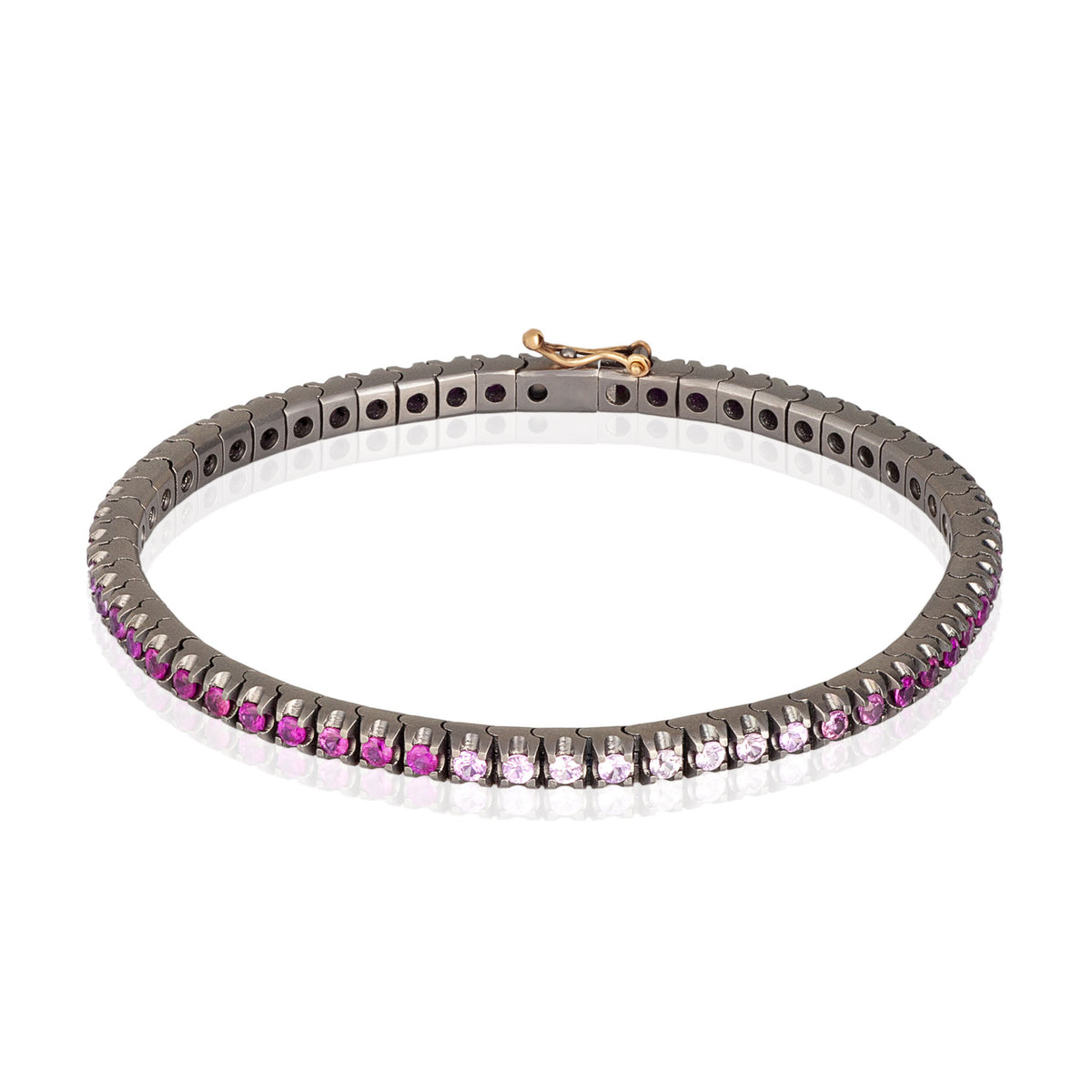 BRACCIALE TENNIS CLASSICO IN TITANIO, ORO ROSSO 18 KT E ZAFFIRI ROSA SFUMATI DA 5 PUNTI.