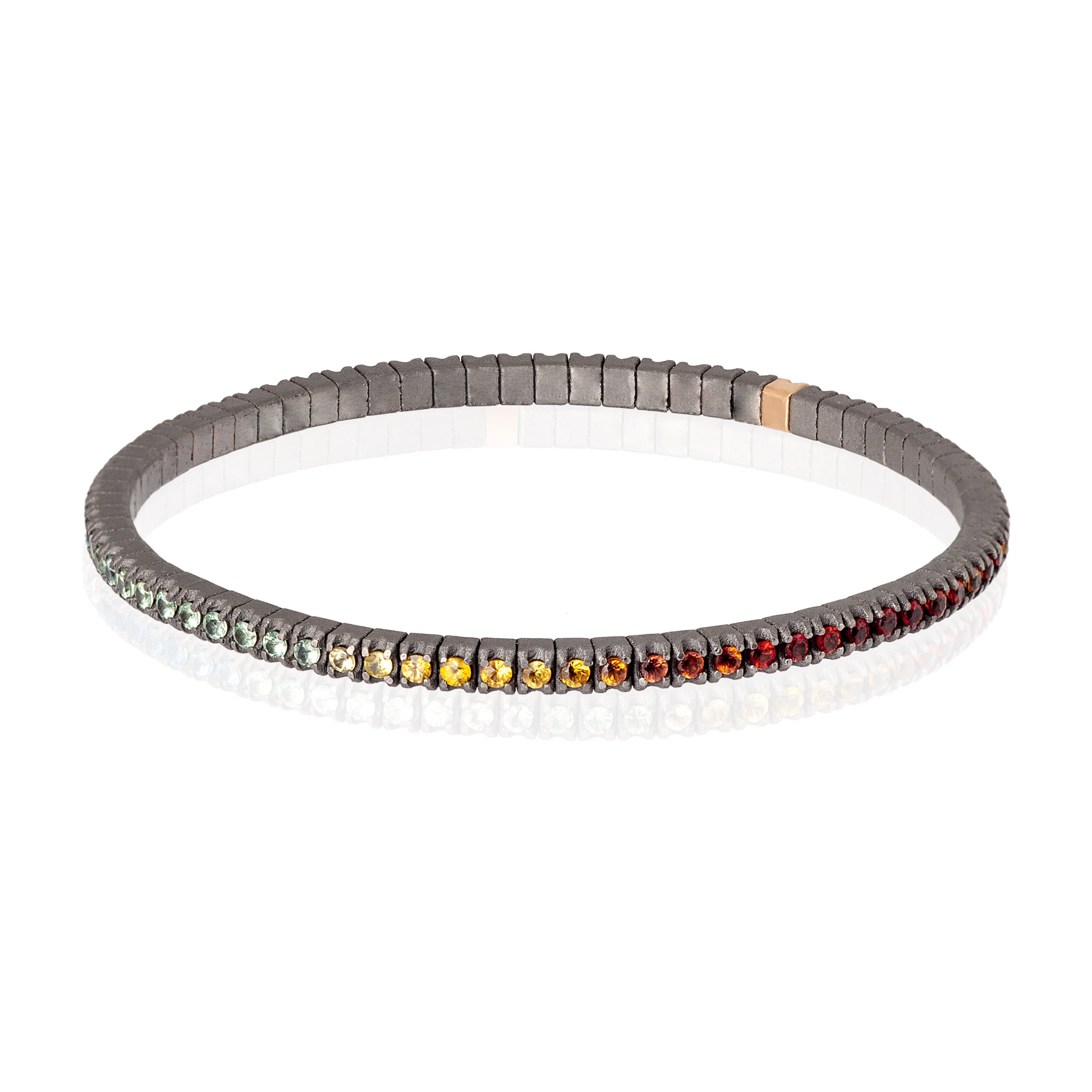 BRACELET TENNIS LIGNE ÉLASTIQUE EN TITANE, OR ROUGE 18 KT ET SAPHIRS MULTICOLORES DE 3 POINTS.