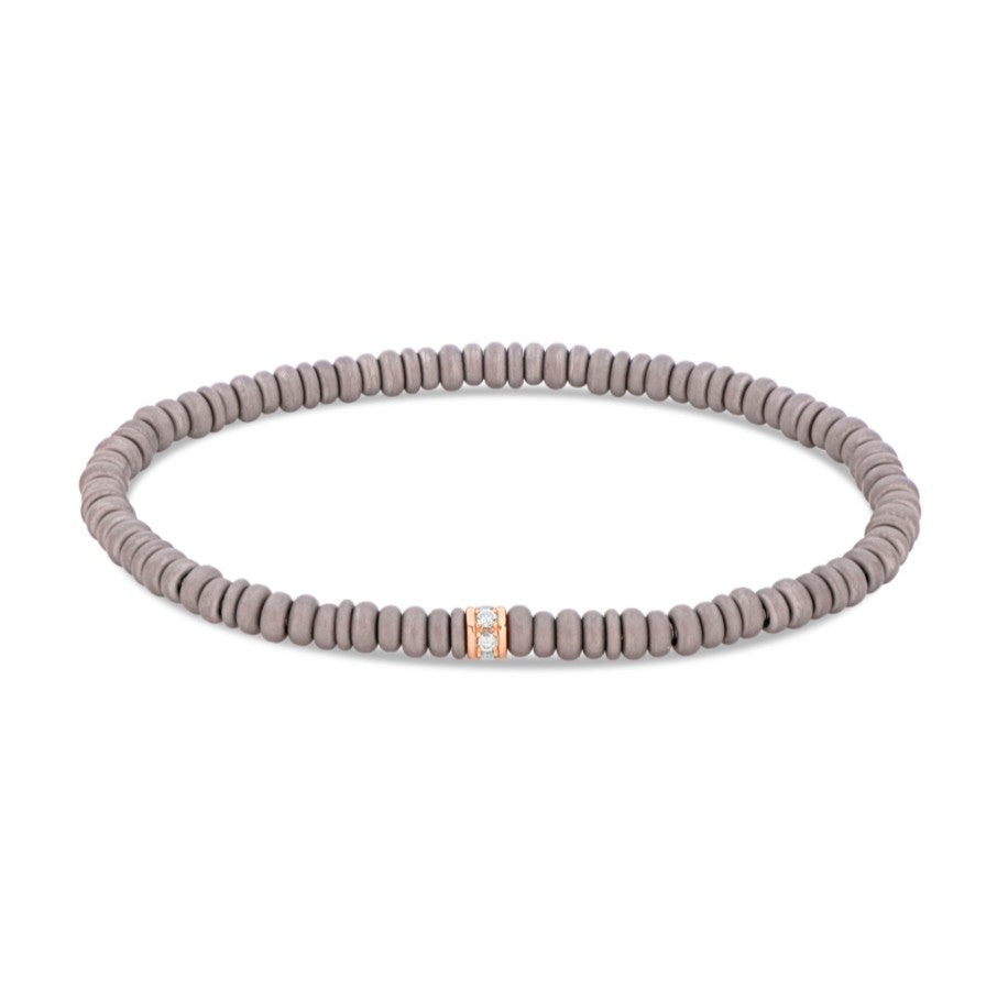 BRACCIALE ELASTICO CON ANELLINI IN TITANIO, RONDELLA IN ORO ROSSO 9 KT CON DIAMANTI BROWN
