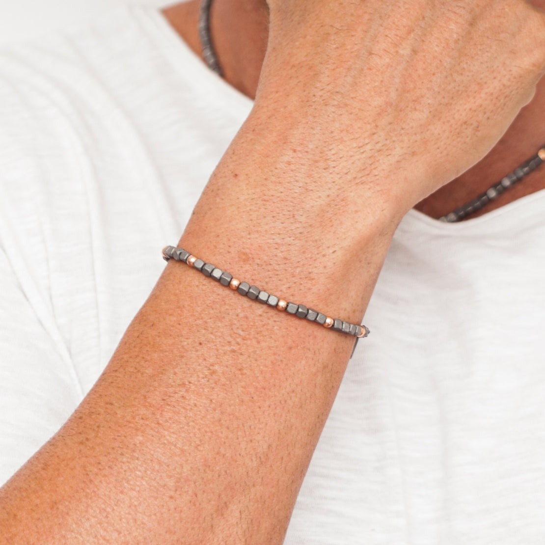 BRACCIALE UOMO IN TITANIO E 9 SFERE IN ORO ROSSO 9KT