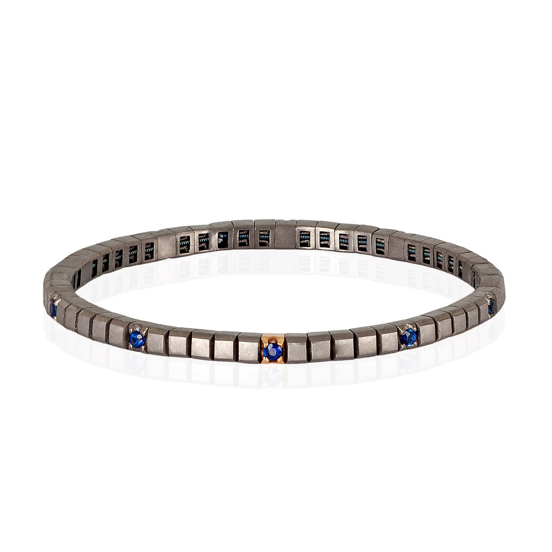 BRACCIALE TENNIS LINEA ELASTICA IN TITANIO, ORO ROSSO 18 KT E 10 ZAFFIRI BLU DA 5 PUNTI.