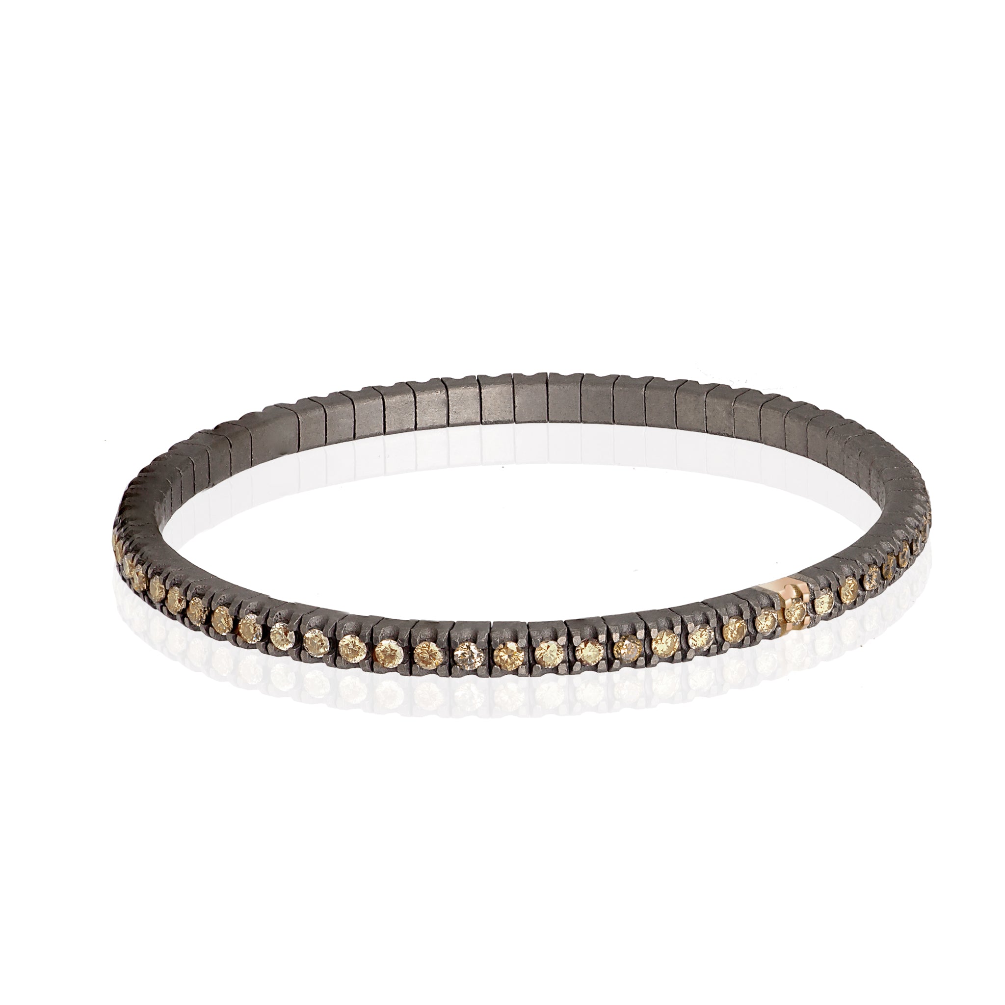 BRACCIALE TENNIS LINEA ELASTICA IN TITANIO, ORO ROSSO 18 KT E DIAMANTI BROWN DA 3 PUNTI.