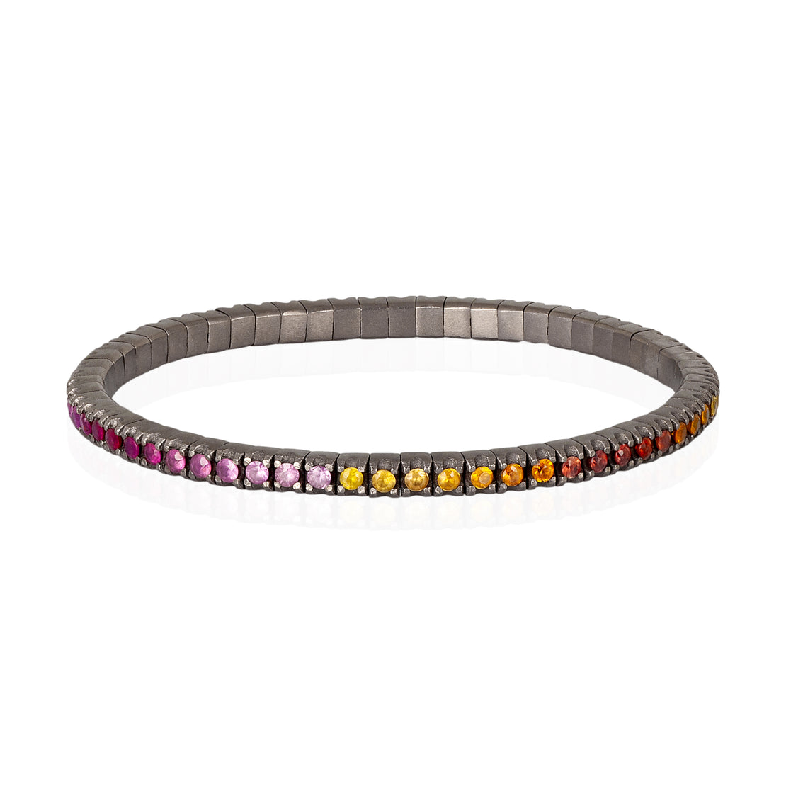 BRACELET TENNIS LIGNE ÉLASTIQUE EN TITANE ET SAPHIRS MULTICOLORES DE 5 POINTS.